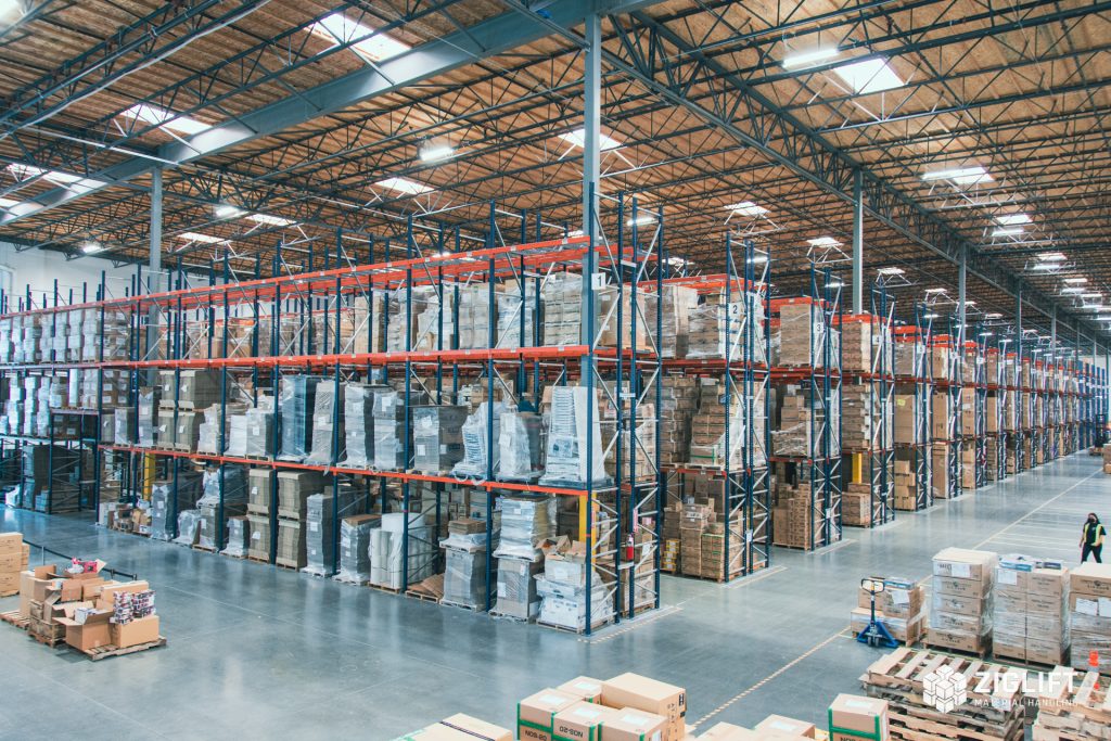 Pallet rack frames and beams in a warehouse storage system